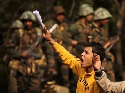Demonstrators stand next to Egyptian soldiers protesters flooded Cairo's central Tahrir Square for the biggest outpouring of anger yet in their relentless drive to oust President Hosni Mubarak's regime