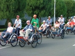 Foreign tourists enjoy cycle tour.