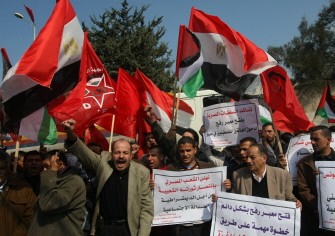 Palestinian supporters of Democratic Front for the Liberation of Palestine (DFLP) shout slogans in support of the protesters in Egypt who forced their President Hosni Mubarak to resign, as they march in a rally in Gaza City on February 14, 2011.