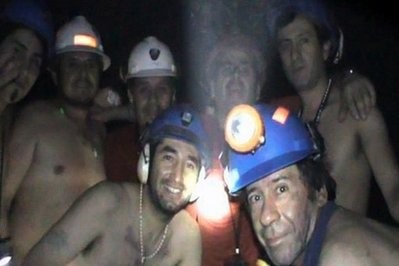 Trapped Chilean miners pose inside the San Jose Mine in September 2010, near Copiapo, north of Santiago, Chile.