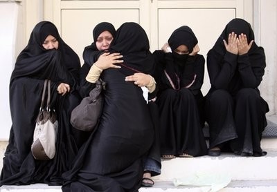 Bahraini women wait outside a hospital in Manama, Bahrain, Thursday, Feb. 17, 2011, where victims of the confrontation between anti-government protestors and riot police were being treated