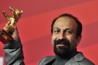 Iranian director Asghar Farhadi poses with the Golden Bear prize awarded for his film "Nader and Simin: A Separation" during a press conference after the awards ceremony of the international Berlinale film festival on February 19, 2011 in Berlin.