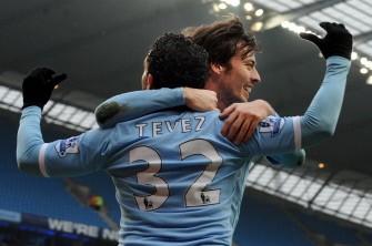 Carlos Tevez (L) celebrates with Spanish midfielder David Silva (R) after scoring against Notts County's during the FA Cup match between Manchester City and Notts County. AFP