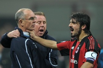 Gattuso (R) grabs Tottenham assistant manager Joe Jordan's neck next to Tottenham manager Harry Redknapp (C) during the Champions League football match AC Milan vs. Tottenham on February 15, 2011 at San Siro Stadium in Milan. AFP