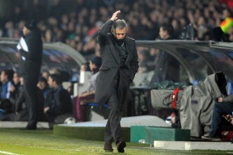 Real Madrid's coach Jose Mournhio reacts during the Champions League football match Olympique de Lyon versus Real Madrid on February 22, 2011. AFP