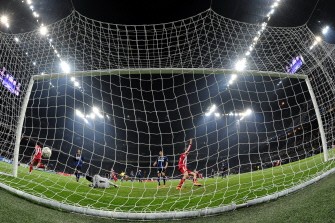 Mario Gomez (L) celebrates after scoring against Inter Milan at San Siro Stadium in Milan. AFP