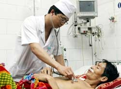 File photo shows a doctor examines a patient at the Pasteur Institute in Ho Chi Minh City.