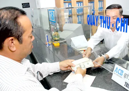 Sau điều chỉnh tỷ giá - Thị trường ngoại hối vận hành tích cực