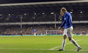 Everton's Phil Neville leaves the pitch after being substituted during the FA Cup match against Reading. AFP