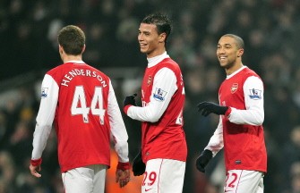 Arsenal's Gael Clichy (R) celebrates scoring the fifth goal during their FA match against Leyton Orient on March 2, 2011. AFP