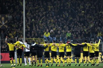 Dortmund's players celebrate after the German first division Bundesliga football match Borussia Dortmund vs FC Cologne. AFP