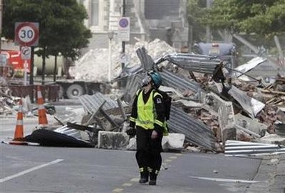A rescue worker walks through the rubble in central Christchurch March 2, 2011