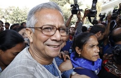 Bangladeshi Nobel laureate Muhammad Yunus smiles as he arrives at the High Court in Dhaka, Bangladesh, Thursday, March 3, 2011