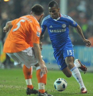 Chelsea's midfielder Florent Malouda (R) vies with Blackpool's defender Neal Eardley during the match. AFP