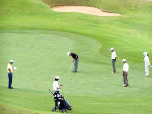 File photo shows golfers playing at Dalat Palace Golf Club (Photo: Tuong Thuy)