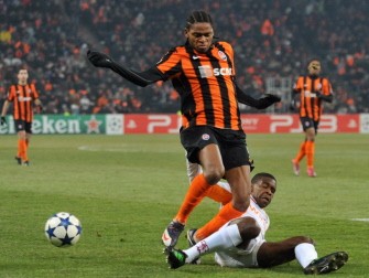 Juan (R) of AS Roma vies for the ball with Luiz Adriano (L) during the football match with FC Shakhtarin in Donetsk on March 8, 2011. Shakhtar won 3:0. AFP
