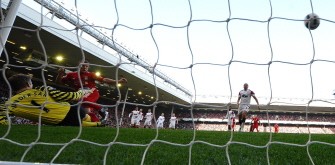 Liverpool's forward Dirk Kuyt (2L) scores his third goal past Manchester United's goalkeeper Edwin van der Sar (L) during the English Premier League match between Liverpool and Manchester United at Anfield, Liverpool, northwest England, on March 6, 2011. AFP