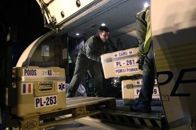 AFP - French Air Force servicemen load relief aid bound for Benghazi, Libya, onto an aircraft at the Velizy-Villacoublay air base southwest of Paris.