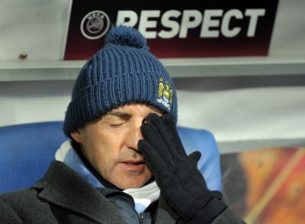 Manchester City coach Roberto Mancini reacts prior the match against Dynamo Kiev in Kiev on March 10, 2011. Dynamo won 2:0. AFP