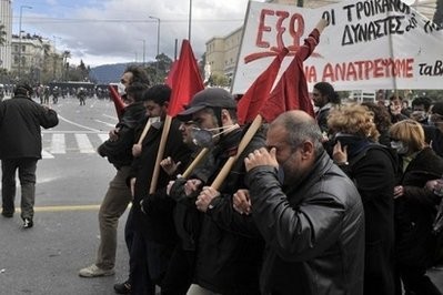 Demonstrators march in Athens in February. Eurozone leaders are expected to agree on greater economic policy coordination Friday as they try to tame a deep-seated debt crisis made worse by markets sceptical that they can stop the rot.