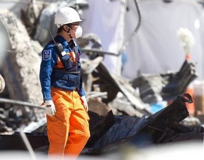 Rescue workers are seen at the site of the collapsed CTV building in quake-ravaged Christchurch