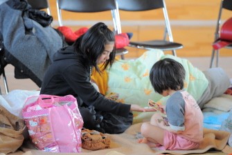 Residents shelter in an evacuation center at Sendai city in Miyagi prefecture on March 14, 2011. AFP