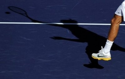 Roger Federer returns the ball during his match against Argentinian Juan Ignacio Chela during the tournament in Indian Wells, California. Federer won 6-0, 6-2.(AFP)