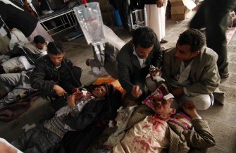 Yemeni medics treat wounded anti-government protesters in Sanaa March 18, 2011 as 46 comrades were killed and scores wounded when pro-regime loyalists and police opened fire on them