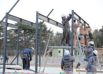Workers begin construction of temporary housing in the devastated town of Rikuzentakata on March 19, 2011. AFP