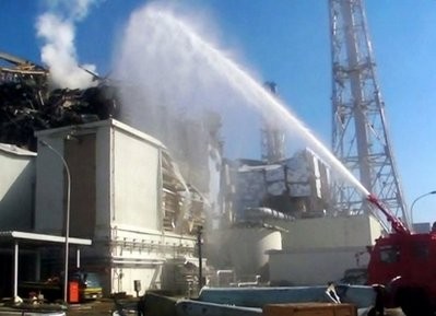 AFP - This image, released by the Japanese Self Defence Ministry on March 19 shows a fire engine dousing reactor number 3 of the Fukushima Dai-ichi nuclear power station.