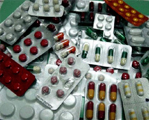 Police seize a large quantity of fake drugs and packaging material after they raid two storage facilities in Ho Chi Minh City on March 14