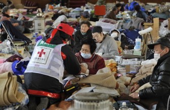 Evacuees rest in a shelter in Kamaishi, Iwate prefecture on March 25, 2011. AFP