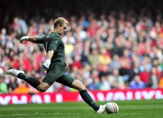 England's goalkeeper Joe Hart kicks the ball during their match against Wales at the Millennium Stadium in Cardiff, on March 26, 2011. AFP