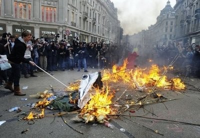 AFP - Activists start a fire at Oxford Circus during a march in London.