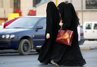 Women walk out of a shopping mall as they wait for their driver to pick them up in Riyadh in 2005