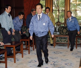Japanese Prime Minister Naoto Kan leaves a cabinet meeting at the National Diet in Tokyo on March 30, 2011. Kan said he was resolved to explore alternative energy sources to power Japan. AFP