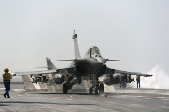 This handout picture released by ECPAD (The French Defence communication and audiovisual production agency) shows a Rafale jet fighter taking off, on March 29, 2011 in the mediterranean sea aboard the French aircraft carrier Charles de Gaulle during military operations in Libya. AFP