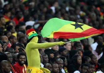 Ghana fans celebrate after Asomoah Gyan's equaliser against England in an international friendly football match at Wembley Stadium in London, on March 29, 2011. AFP