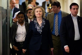 AFP - U.S. Secretary of State Hillary Clinton (C) leaves a briefing for Senators in the U.S. Capitol on March 30, 2011 in Washington, DC. Secretary Clinton, along with Secretary of Defense Robert Gates, National Intelligence Director James Clapper, Chairman of the Joint Chiefs of Staff Admiral Mike Mullen, and Deputy Treasury Secretary Neal Wolin, briefed members of the Senate on the U.S. military intervention in Libya.