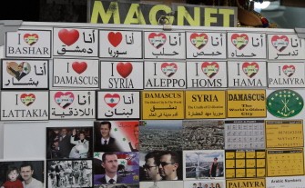 AFP - Fridge magnets are displayed at a shop selling items for tourists in the capital Damascus on April 30, 2011.