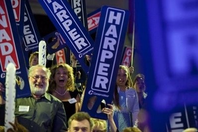 AFP - Conservative supporters react to the projection of a Conservative majority government at the Telus Convention Centre in Calgary, Alberta, May 2, 2011