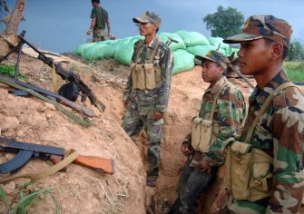 AFP - Cambodian soldiers stand guard near the Thai-Cambodia border in Samrong in Oddar Meanchey province on May 1, 2011