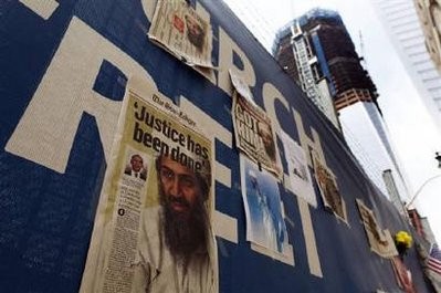 Newspapers fronts are seen on a fence at the World Trade Center site in New York, May 3, 2011 after U.S. forces killed Osama Bin Laden in Pakistan early Monday.
