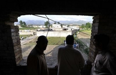 AFP - Locals look at the hideout house of slain Al-Qaeda leader Osama bin Laden in Abbottabad.