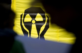 AFP - A Greenpeace banner reading "Save the children in Fukushima" during a protest in front of Japan's Embassy in Berlin on May 4, 2011 in Berlin, Germany.