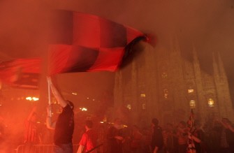 AFP - AC Milan's supporters celebrate in Milan on May 7, 2011 for the championship