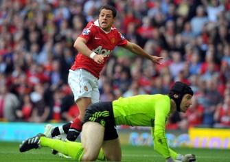 Manchester United's forward Javier Hernandez (up) watches as his shot go past Chelsea's Czech goalkeeper Petr Cech to score during the game. AFP