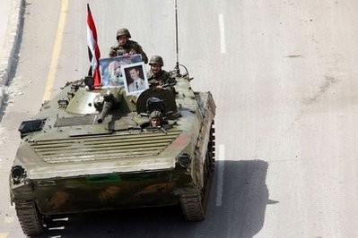 In this picture taken on a guided government tour, shows Syrian army troops in southern protest hub of Daraa on May 5