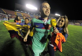AFP - Barcelona's midfielder Andres Iniesta celebrates after the football match against Levante on May 11, 2011