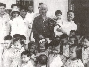 File photo shows late President Ho Chi Minh with Vietnamese children
